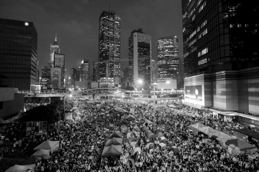 Protesters fill the streets as tens of thousands come to the main protest site one month after the Hong Kong police used tear gas to disperse protesters October 28, 2014 in Hong Kong, Hong Kong. A peaceful safe atmosphere remains at the massive protest site as artists freely express themselves and families bring their children to experience the Umbrella Revolution. (Photo by Guillaume Payen/NurPhoto)