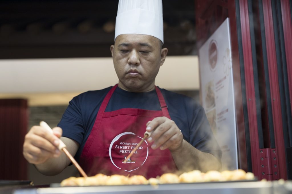 chef-yoshihiro-tanaka-from-the-bib-gourmand-awarded-kougaryu-honten-prepares-his-traditional-takoyaki-from-his-popular-street-food-stalls-in-osaka