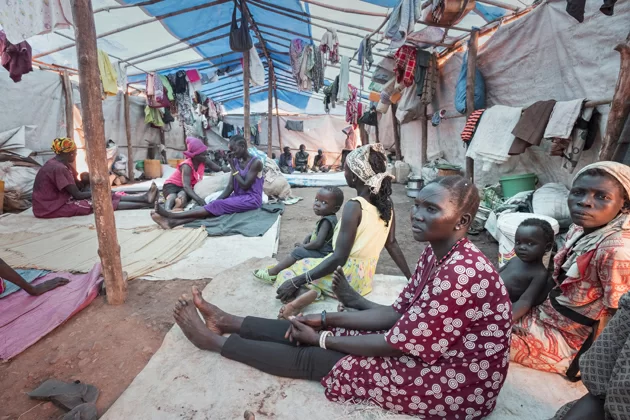 "We want peace." Internally displaced women and children are photographed in their shelter at POC3 camp in Juba during a visit by the United Nations High Commissioner for Refugees Filippo Grandi. ; The refugee crisis in South Sudan has displaced almost 4 million people since the conflict began in December 2013. In July 2016, the disastrous breakdown of peace efforts in South Sudan contributed to a mass outflow of people fleeing for their lives. By June 2017, nearly 1.87 million people had fled the country and a further 1.9 million were internally displaced. Two-thirds are under the age of 18 and many of them have witnessed brutal violence, fleeing their villages when armed groups burned down their houses and killed their neighbours. During a three-day visit to the world's fastest growing displacement crisis, UNHCR chief Filippo Grandi said peace is the only lasting solution for the millions of displaced.