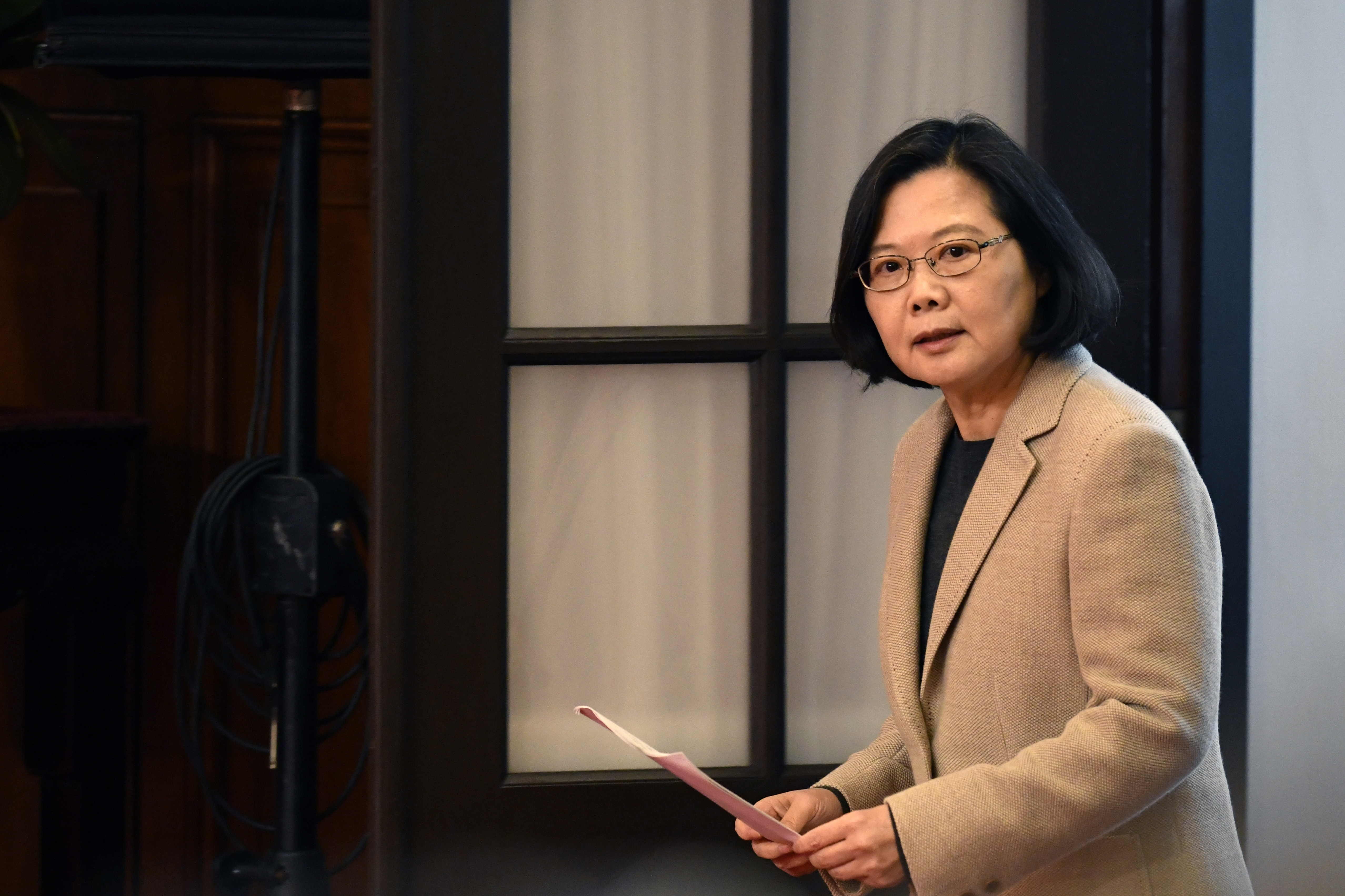 Taiwan's President Tsai Ing-wen arrives for a press conference at the Presidential Palace after the national flag raising ceremony in Taipei on January 1, 2019. (Photo by Sam YEH / AFP)