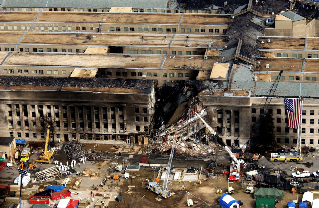 Aerial view of the Pentagon Building located in Washington, District of Columbia (DC), showing emergency crews responding to the destruction caused when a high-jacked commercial jetliner crashed into the southwest corner of the building, during the 9/11 terrorists attacks.