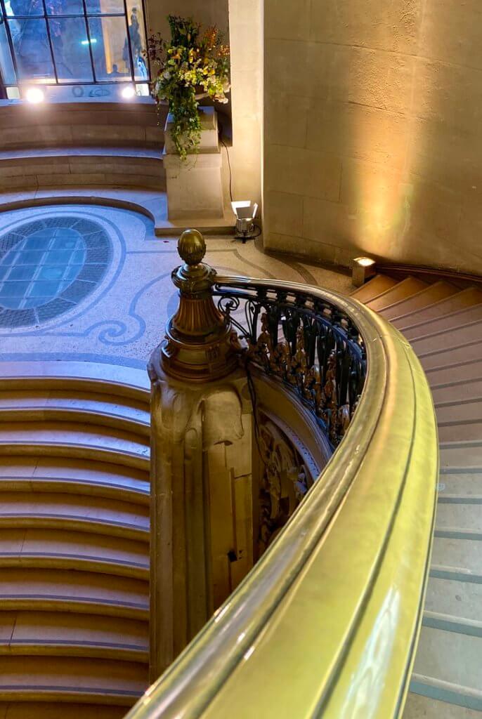 A beautiful sweeping stairway in the Grand Palais in Paris, France.