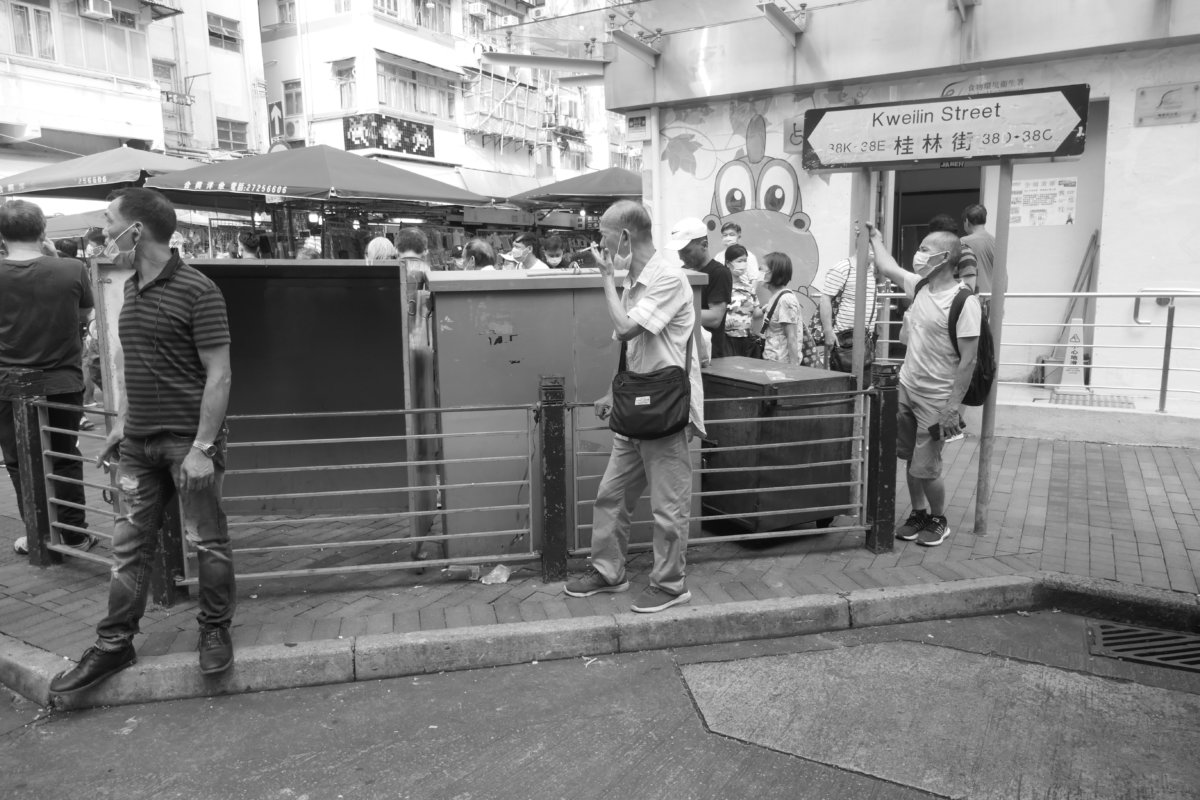 Street campaigning and watched by bystanders, Sham Shui Po, Kowloon, Hong Kong, 14 June 2020. (photograph: John Batten) 