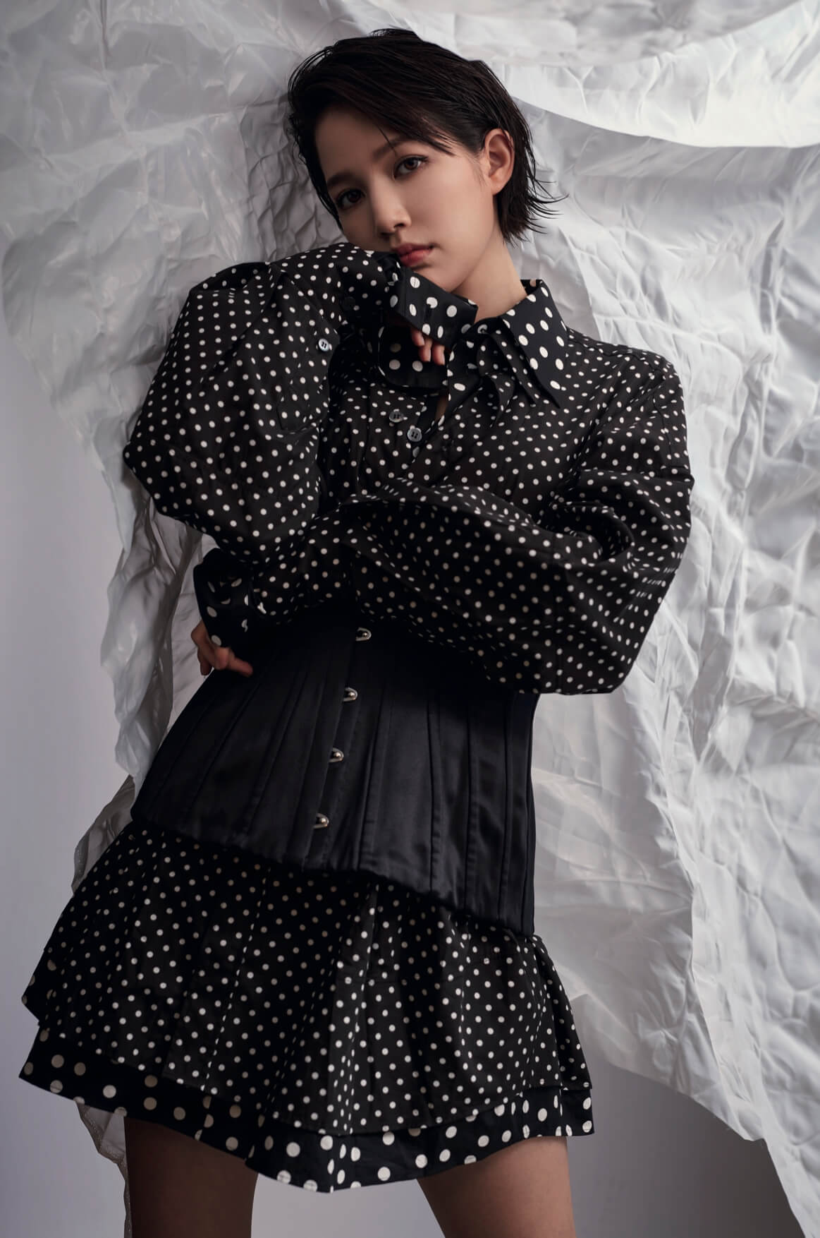 Polka dot Shirt $8,500 Black corset $7,100 both from DOLCE & GABBANA