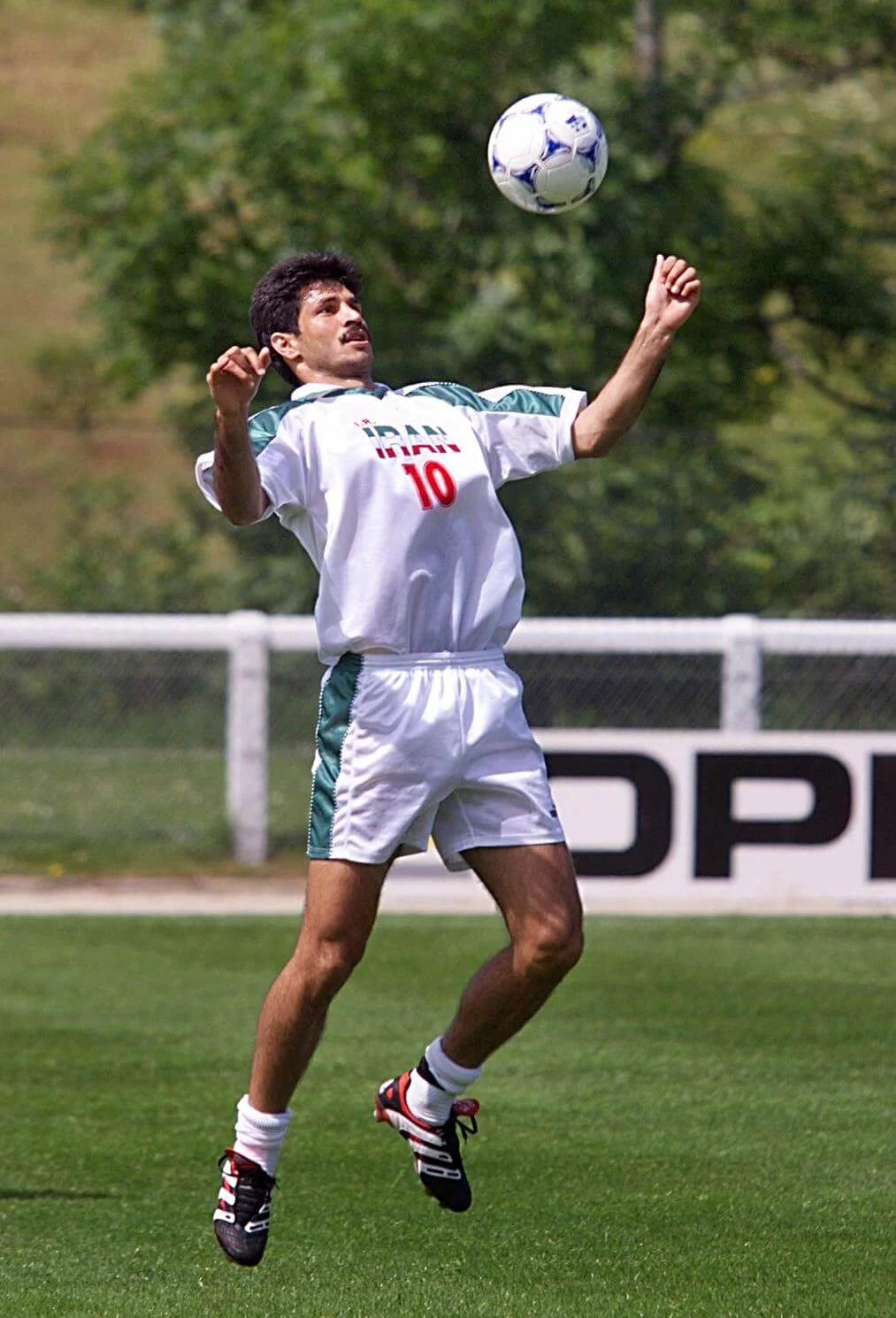 Star of the Iranian national soccer team Ali Daei plays with the ball 09 June at the Yssingeaux stadium, center France, during a training session. Iran, who will play in group F, will play against Yugoslavia 14 June in Saint-Etienne, center France. . (ELECTRONIC IMAGE) (Photo by Eric Feferberg / AFP)