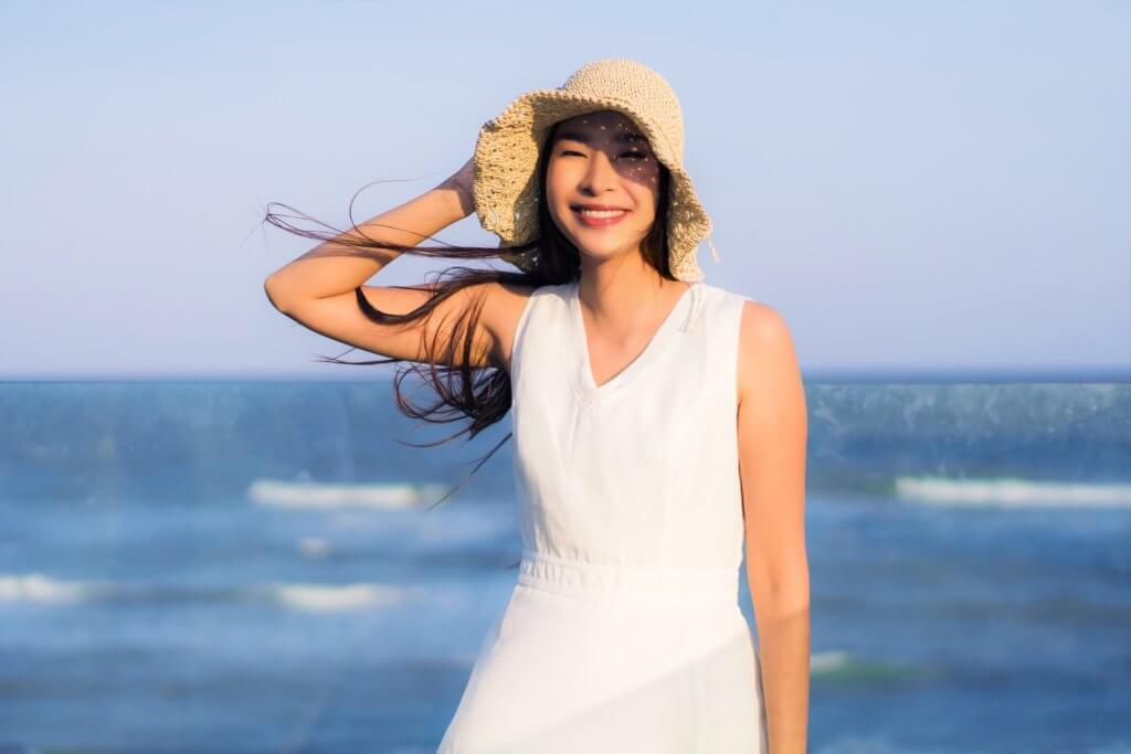 portrait-beautiful-young-asian-woman-happy-smile-beach-sea-oceann