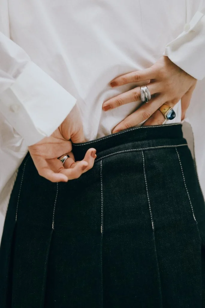 (LEFT) FRED Pain de Sucre ring in white gold and grey mother-of-pearl (RIGHT) FRED Success ring in white gold and diamonds Pain de Sure ring in yellow gold and diamonds and blue London topaz cabochon WEEKEND MAX MARA WHITE SHIRT DENIM SKIRT 