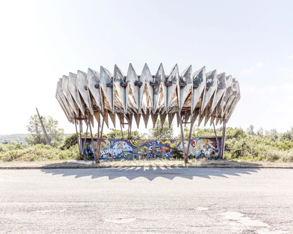 George Chakhava was the deputy Minister of highway construction in the 1970s in Georgia. He was also an artist and architect creating iconic brutalist buildings like the Ministry of Highway construction building in Tbilisi (Bank of Georgia today) but also designing some of the most creative bus stops like this one, often experimenting on spot with techniques.  
(From the Soviet Busstops Documentary Film coming in Fall 2022.)
Location: Pitsunda in the disputed region of Abkhazia/Georgia. 
Photo:Christopher Herwig @herwig_photo  
#sovietbusstops 
#design #instatravel #travelgram #travelphotography #wanderlust #roadside #documentary  #architecture #modernism #modernistarchitecture #sovietarchitecture #sovmod #socialistmodernism #socialistarchitecture #совмод #ussr #soviet #ссср #советский #советскиймодернизм #brutgroup #brutal_architecture #brutalism #brutalist #brutalistarchitecture⁠