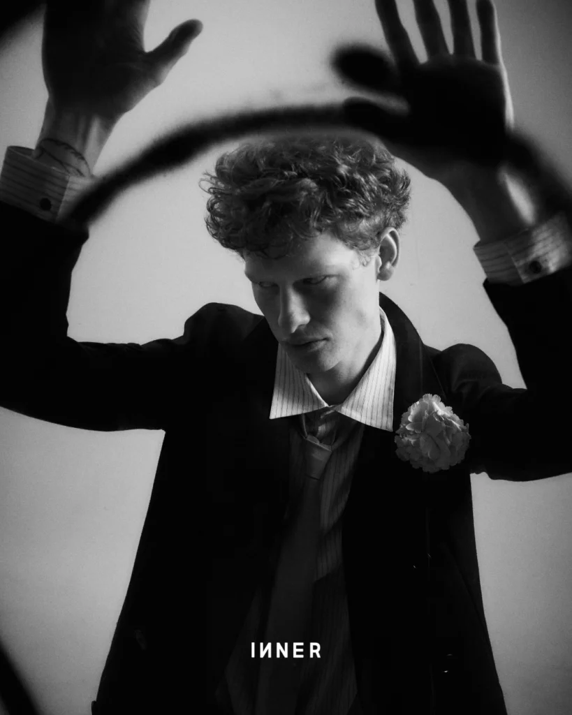 BLAZER & SHIRT, HERMÈS TIE, GUCCI BROOCH, PRADA