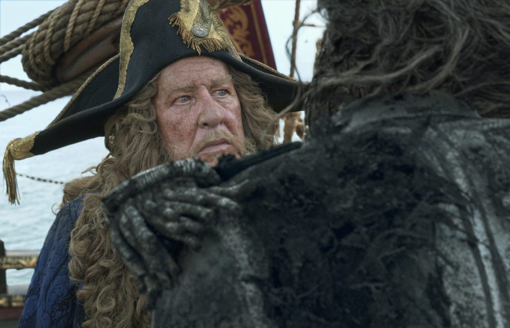 "PIRATES OF THE CARIBBEAN: DEAD MEN TELL NO TALES"..The villainous Captain Salazar (Javier Bardem) pursues Jack Sparrow (Johnny Depp) as he searches for the trident used by Poseidon...Pictured: Geoffrey Rush (Barbossa)..Ph: Film Frame..© Disney Enterprises, Inc. All Rights Reserved.