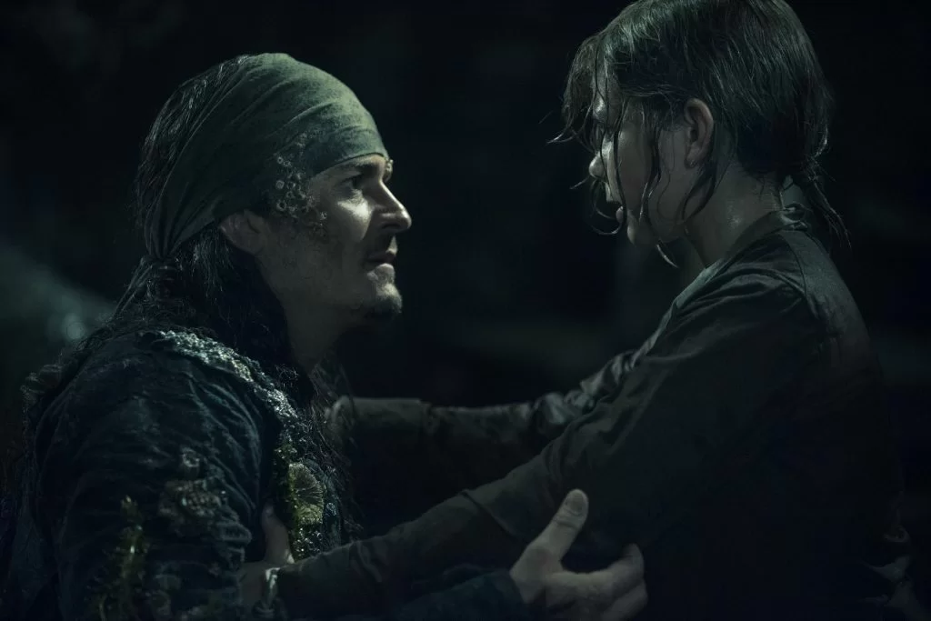 "PIRATES OF THE CARIBBEAN: DEAD MEN TELL NO TALES"..The villainous Captain Salazar (Javier Bardem) pursues Jack Sparrow (Johnny Depp) as he searches for the trident used by Poseidon..Pictured L-R: Orlando Bloom (Will Turner) and Lewis McGowen (Young Henry)..Ph: Peter Mountain..© Disney Enterprises, Inc. All Rights Reserved.