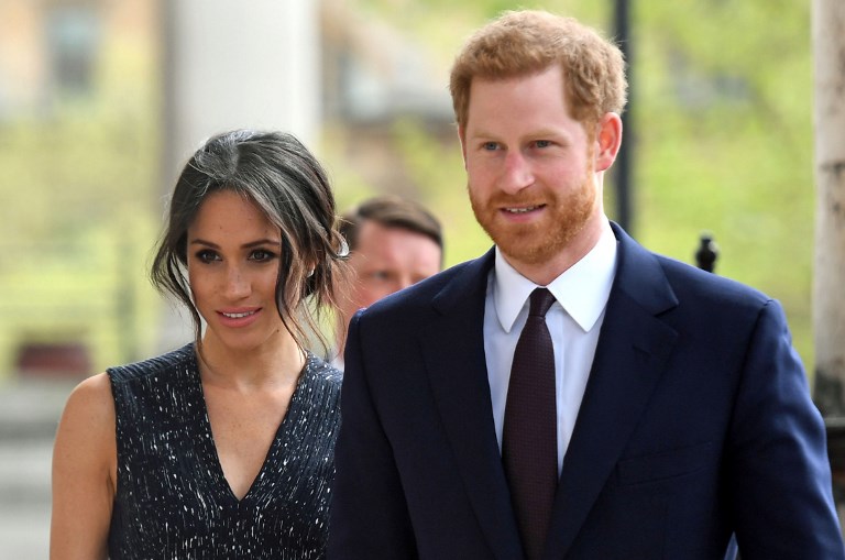 Britain's Prince Harry (R) and his US fiancee Meghan Markle arrive to attend a memorial service at St Martin-in-the-Fields in Trafalgar Square in London, on April 23, 2018, to commemorate the 25th anniversary of the murder of Stephen Lawrence. Prince Harry will attended a memorial on Monday marking the 25th anniversary of the racist murder of black teenager Stephen Lawrence in a killing that triggered far-reaching changes to British attitudes and policing. The prince and his fiancee Meghan Markle joined Stephen's mother Doreen Lawrence, who campaigned tirelessly for justice after her son was brutally stabbed to death at a bus stop on April 22, 1993. / AFP PHOTO / POOL / Victoria Jones