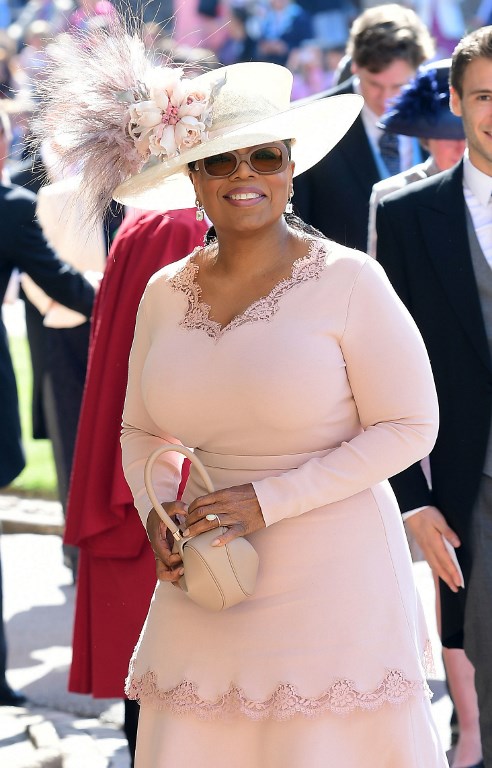 US presenter Oprah Winfrey arrives for the wedding ceremony of Britain's Prince Harry, Duke of Sussex and US actress Meghan Markle at St George's Chapel, Windsor Castle, in Windsor, on May 19, 2018. / AFP PHOTO / POOL / Ian West