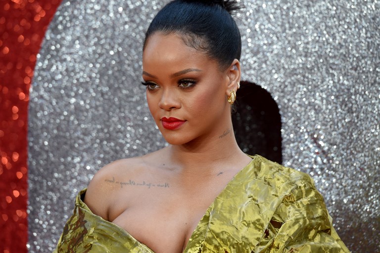 Barbadian singer and actress Rihanna poses on the carpet upon arrival to attend he European premiere of the film " Ocean's 8" in London on June 13, 2018. / AFP PHOTO / Anthony HARVEY