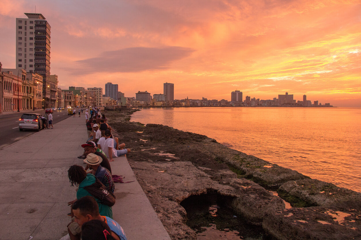 The crowded Cuban Malecon during sunset