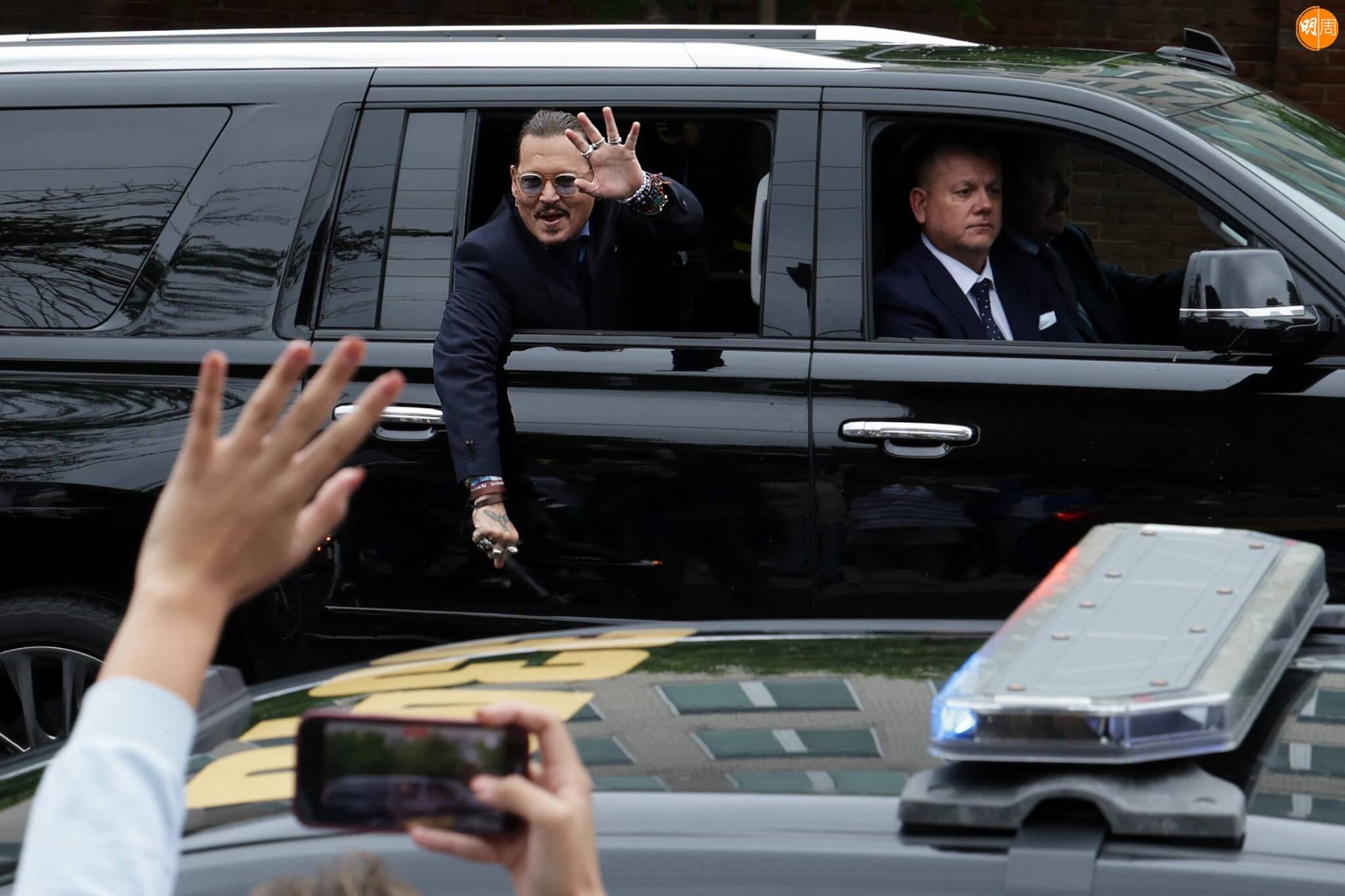 FAIRFAX, VIRGINIA - MAY 27: Actor Johnny Depp waves to supporters from his vehicle as he leaves a Fairfax County Courthouse May 27, 2022 in Fairfax, Virginia. The jury has started deliberation in the Depp v. Heard defamation trial, brought by Johnny Depp against his ex-wife Amber Heard. Alex Wong/Getty Images/AFP (Photo by ALEX WONG / GETTY IMAGES NORTH AMERICA / Getty Images via AFP)